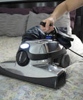 Person vacuuming bedspread with Kirby vacuum using G3 G4 Vacuum Brush Roll Replacement 156294 OEM Authorized Genuine Part