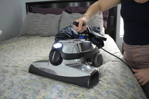Person vacuuming bedspread with Kirby vacuum using G3 G4 Vacuum Brush Roll Replacement 156294 OEM Authorized Genuine Part
