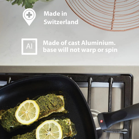 9.5 Inch Diamond Coated Nonstick Fry Pan Induction Ready Aluminum Skillet Oven Safe To 500 F with fish cooking, on stovetop.