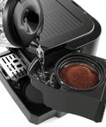 All In One Coffee And Espresso Machine With 47 Ounce Capacity For Home Barista Style Brews water tank being filled