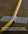 Multi-Use Silver Duct Tape 1.88 in x 60 yd x 7 mil used on a wet yellow hose for repair.