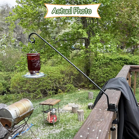 Rock Solid Heavy Duty Deck Rail Hook With 32 Inch Pole Hangs Planters Bird Feeders Lanterns And Wind Chimes Up To 15 Lbs No Sweat Install Totally Locked Down For Patios And Backyards showing feeder in garden.