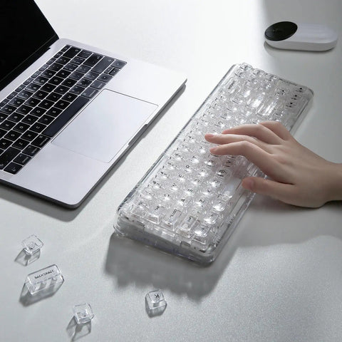 Compact Wireless Mechanical Keyboard Featuring Hot Swap Switches And Clear Caps For Streamlined Desk Setup Custom Backlight And Gasket Mount, shown with a hand typing.