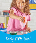 Child using Big Grip Eyedroppers for Kids Easy Squeeze Jumbo Droppers for hands-on science fun with water and colors.