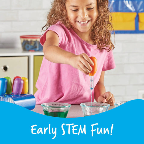 Child using Big Grip Eyedroppers for Kids Easy Squeeze Jumbo Droppers for hands-on science fun with water and colors.