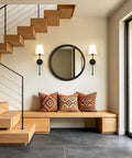 KSANA Modern Black Wall Scone Lighting Indoor with White Fabric Shade beside a seating area with decorative pillows.