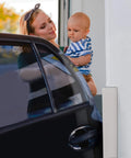 Two-Pack High Density Corner Guard Edge Protector And Bumper For Garages And Workshops installed on wall near car door with woman and child