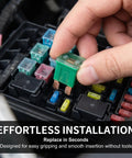 Hand inserting a green 40 amp fuse into a fuse box, showcasing Road Ready 30 Piece Automotive Cartridge Fuse Assortment Kit.