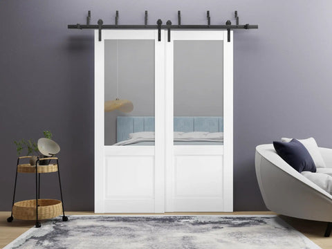 White Barn Style Sliding Doors Set For Interior Use With Clear Glass And Solid Wood Panels 84 By 96 Inches in a modern room