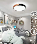 Dimmable 19 Inch Round LED Ceiling Light With Remote Sleek Modern Minimalist Black Flush Mount in a bedroom setting