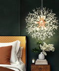 Lit Dandelion Crystal Chandelier With Firework Sparkle 9 Light Gold Pendant Light Fixture illuminating a bedroom beside bed