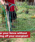 Person demonstrating Gate Handle Kit For Electric And Non-Electric Fences With Handles, Hooks, Stakes, Guylines, And Pegs