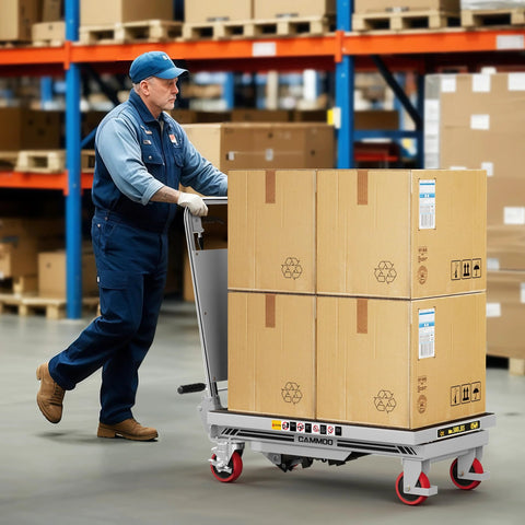 Side view of CAMMOO hydraulic lift table cart, gray frame with red wheels, carrying four large cardboard boxes.