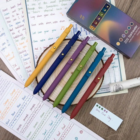 Six Pack Gel Ink Pens With 0.5mm Fine Point, Smooth Flow For Journaling And Note Taking, Color Coded Set on wooden table
