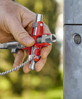Hand holding Universal Construction Control Cabinet Key with Plug In Magnetic Support for Profile Cylinder Locks