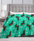 Hella Comfy Dachshund Throw Blanket For Kids Boys And Girls Ultra Soft Fuzzy Weenie Dog Breathable Couch Wrap Total Chill Gift 40 By 50 Inches All Season Rad Vibes on a bed with a grey headboard.