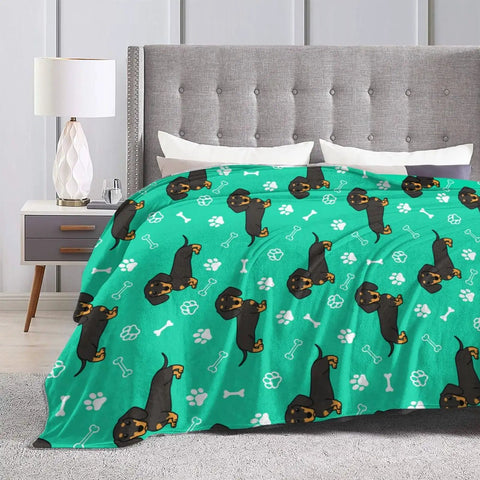 Hella Comfy Dachshund Throw Blanket For Kids Boys And Girls Ultra Soft Fuzzy Weenie Dog Breathable Couch Wrap Total Chill Gift 40 By 50 Inches All Season Rad Vibes on a bed with a grey headboard.