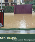Flooded driveway with closed gate showing the need for 5 Pack Water Barrier Flood Barriers, 5 Ft Long by 6.5 In Wide, Reusable Sandless Flood Sandbags for Home Doors, Garage and Basement, Easy Fill and Expand to 3 to 4 Inches, Lightweight, Compact Storage, Prevent Water Damage.