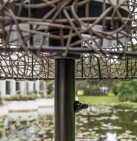Close-up of Tanglewood Outdoor Floor Lamp in oil rubbed bronze with a frosted bulb shield, reflecting elegant outdoor design.