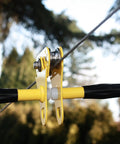 Close-up of Ultimate 150 Foot Zip Line Kit With Galvanized Quarter Inch Cable and stainless dual bearing trolley