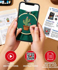Person using 2026 Upgraded Removable Stitch Book Kit With Extra Thick Threads, Needles, Threader, Thimble Sewing Tool, DIY Embroidery Stitch Bo-ok Kit, 108 Patterns For DIY And Sew Enthusiasts, viewing tutorial on phone with cactus embroidery.