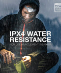 Person wearing Vision HD LED Headlamp Pro Two Pack IPX4 Water Resistant Head Light in rain with waterproof gear.