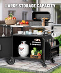 Outdoor Grill Cart With Cabinet And Locking Wheels, Extra Wide Stainless Steel Prep Table, Large Spice Rack, Weatherproof Kitchen Island For BBQ, Cooking And Prep Station with open storage showcasing dishes and condiments on patio.