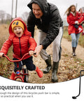 Parent guiding child on a bike with Kids Bike Safety Trainer Handle And Balance Push Bar for confidence building and safe fun biking.