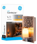 Candle Lite Plug In Night Light With Dusk To Dawn Sensor Flameless LED Candle Sunset Glow Oil Rubbed Bronze Finish next to its packaging