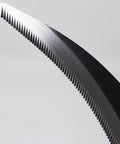 Close-up of serrated blade of Go-To 6.7 Inch Japanese Serrated Garden Sickle With Razor Sharp Carbon Steel Blade For Harvesting And Weeding Made In Japan