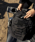 Close-up of Wakizashi Tactical Backpack 24L With MOLLE System on outdoor chair, black 100% polyester, in use for EDC.