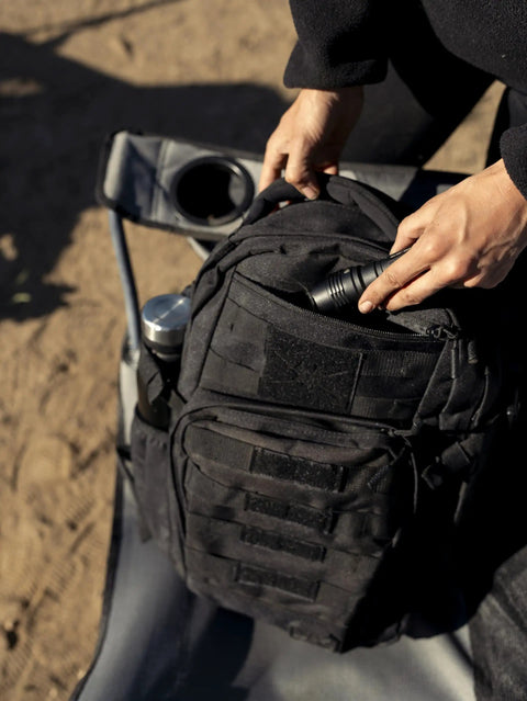 Close-up of Wakizashi Tactical Backpack 24L With MOLLE System on outdoor chair, black 100% polyester, in use for EDC.
