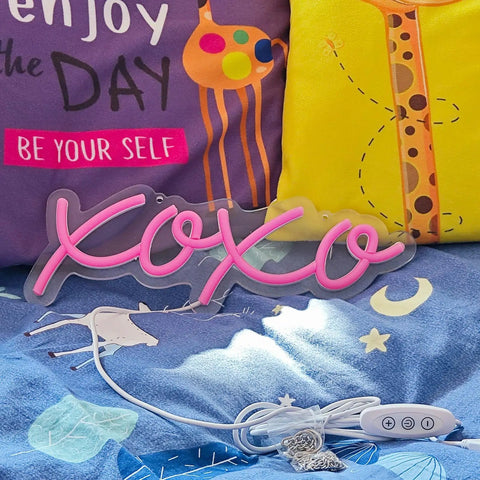 XOXO Neon LED Light Sign Night Light USB Operated Marquee Decoration, shown with pillows and power cord, 13x30 cm, silicone