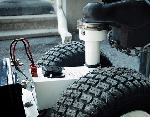 Close-up of Force 5K Electric Trailer Dolly For RV, Boat And Cargo Trailers with sturdy tires and battery connections.