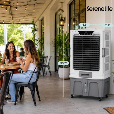 Heavy Duty Portable Evaporative Air Cooler With 12000 CFM Hella Badass Cooling For Large Indoor Outdoor Spaces Sweet Chill With 12 Hour Timer Smart App Remote Control next to two women in a cafe.