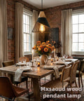 Dining room with Dope Black Farmhouse Wooden Pendant Light, rustic wood and metal, over a set dining table.
