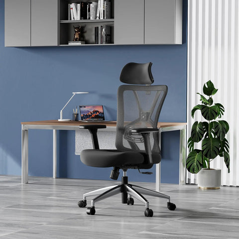 Ergonomic Mesh Office Chair With High Back, Adjustable Lumbar Support, Headrest And 3D Armrests at a modern desk.