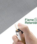 Hand testing flame resistance on Fiberglass Window Screen Mesh Replacement Roll 39 Inch By 32 Point Eight Feet Gray No Fuss.