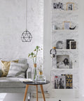 Bookshelf with Grey Marble Peel And Stick Self-Adhesive Film Roll 17 Inch By 78 Inch displaying books and decor items in a living room
