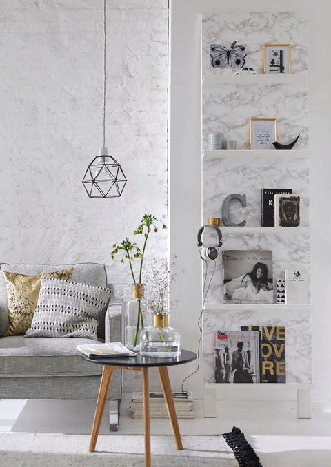 Bookshelf with Grey Marble Peel And Stick Self-Adhesive Film Roll 17 Inch By 78 Inch displaying books and decor items in a living room