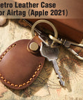 Premium Handmade Genuine Leather AirTag Holder And Keychain With Heavy Duty Rings Protective Case Compatible With Apple AirTags First And Second Gen Straight Up Solid Brown on a vintage map.