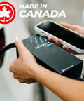 Hand holding a sleek Slick And Hella Tough Portable Electric Vehicle Charger Up To 40 Amp Level 1-2 Fast Charging Station Nema 14-50 Plug.