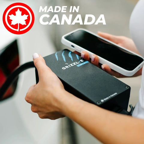 Hand holding a sleek Slick And Hella Tough Portable Electric Vehicle Charger Up To 40 Amp Level 1-2 Fast Charging Station Nema 14-50 Plug.