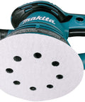 Power sander with attached 5-inch disc from Multi Grit 30 Piece Five Inch Random Orbit Sanding Disc Set With Eight Hole Hook And Loop