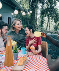 Group enjoying meal with Portable Fly Fans For Tables That Keep Your Food Clean Anywhere You Eat Outdoor Indoor Picnic Dinner Wood Grain