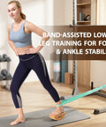 Reversible Half Moon Cork Yoga Block Pair Solid Game Changer Balance Trainer For Steady Moves And Epic Wobble Vibes Natural Cork Build being used in band-assisted leg training.