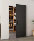 Concealed Sliding Barn Door With Soft Close For Interior Use, Black Vinyl Wrapped Hidden Barn Door, 30x84 Inches installed view