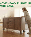 Eight Pack Extra Large Furniture Sliders For Carpet And Hardwood Floors Heavy Duty Reusable Gliders seen in use moving a wooden cabinet.