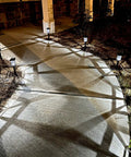 Solar Pathway Lights Outdoor LED Solar Powered Garden Lights illuminate a curved walkway at night, showing IP44 weatherproof design.