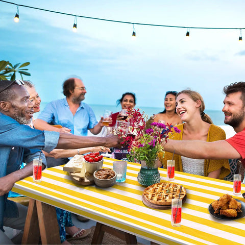 Group enjoying meal on outdoor table with Stripe Picnic Table Cover Set With Bench Covers 72 X 30 Inch Fitted Waterproof Vinyl Tablecloth.